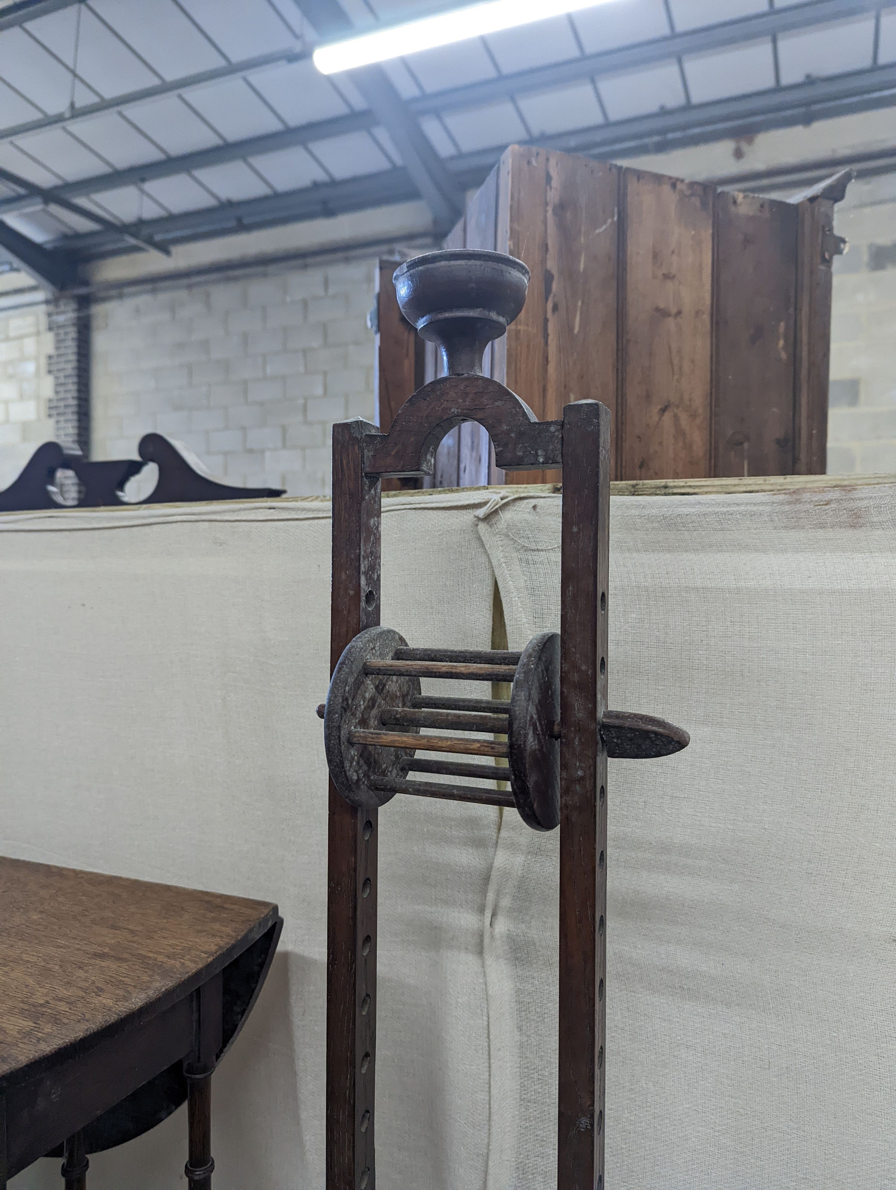 A Sutherland spider leg table and bobbin/wool winder, height 105cm